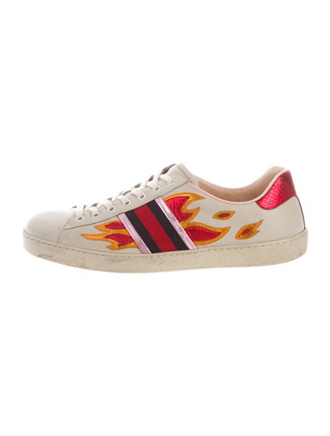 gucci flame sneakers.